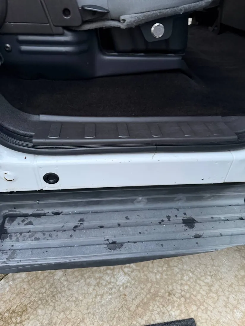 Door sill before cleaning, stained and dirty